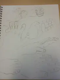 Pencil study of hands in several poses in a sketchbook